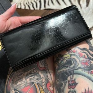 Black patent leather Lovcat Paris wallet with hearts